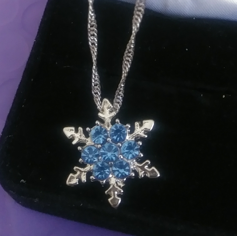 Blue and white topaz snowflake necklace